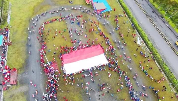 Ilustrasi berita Papua: Bendera Merah Putih Raksasa Berkibar di Mulia Puncak Jaya